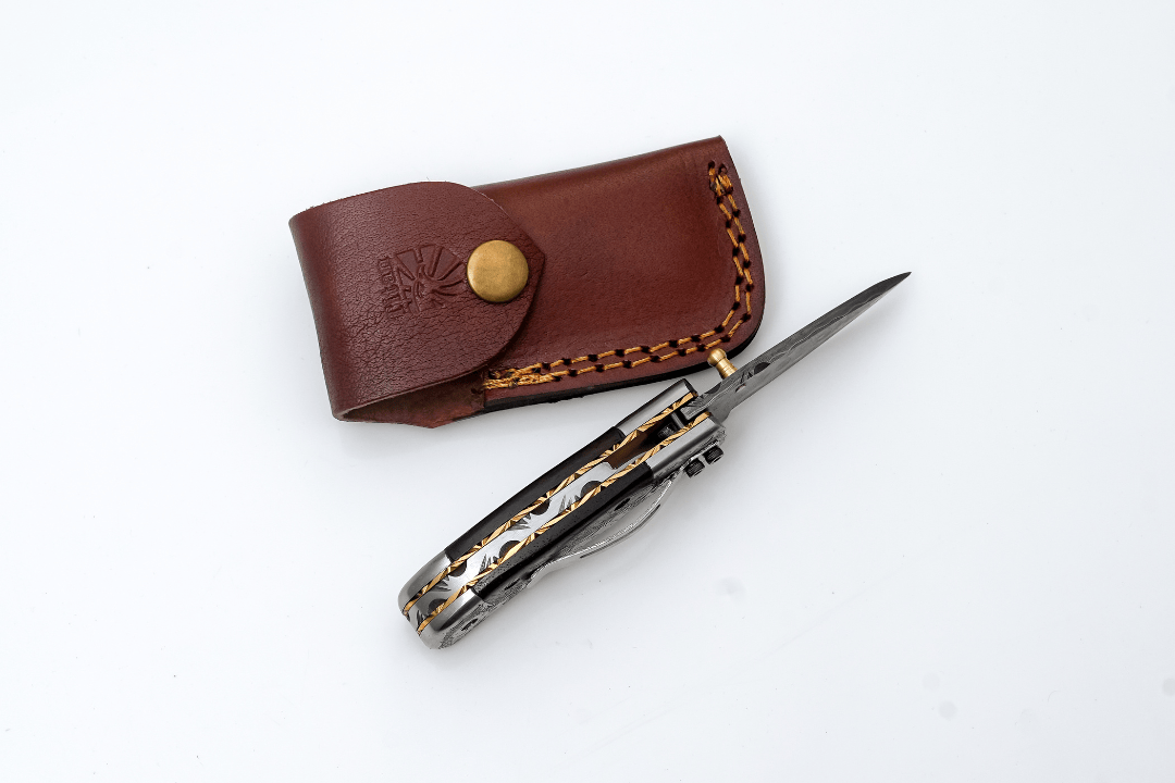 Titan International Titan International - Hand-Forged Damascus Folding Knife | Engraved Bolster, Dark Wood Handle & Intricate Spine File Work