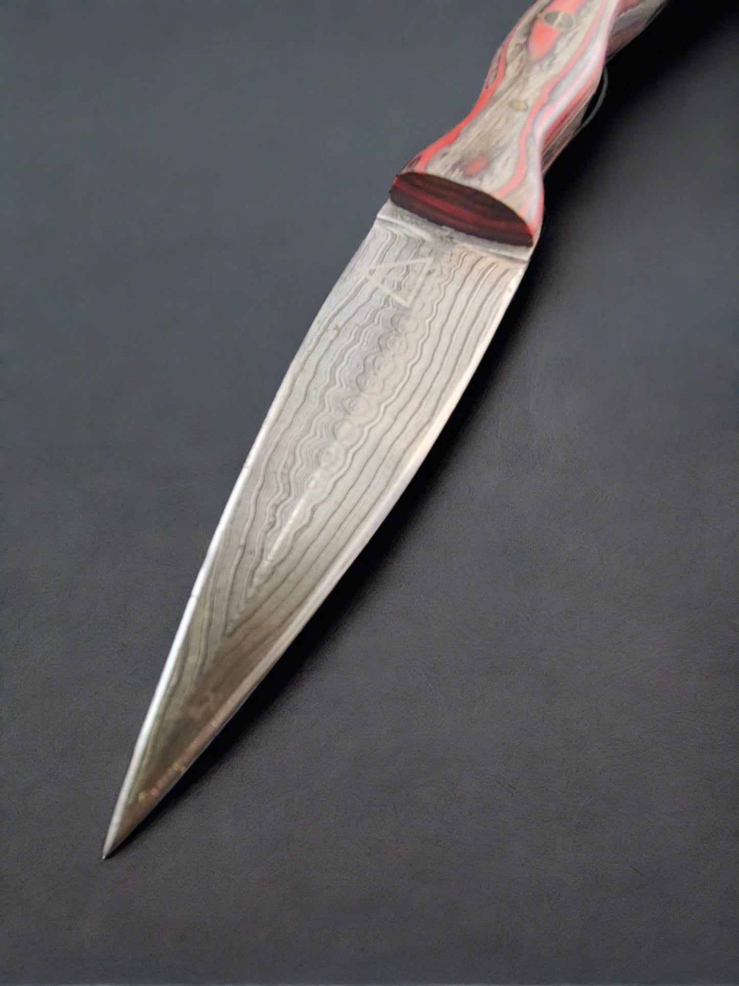 Man Up Damascus Dagger with red and gray wood handle.