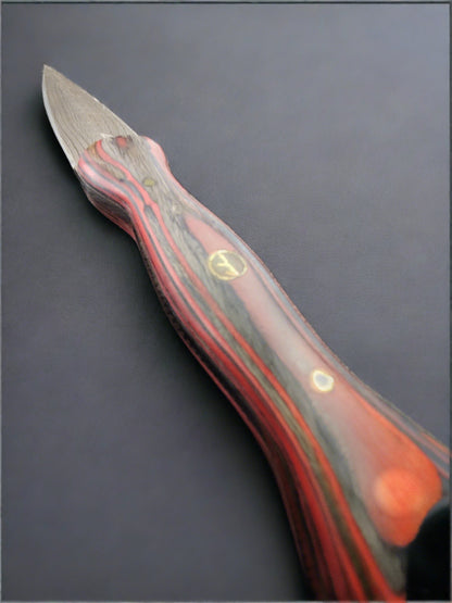 Man Up Damascus Dagger with red and gray wood handle.