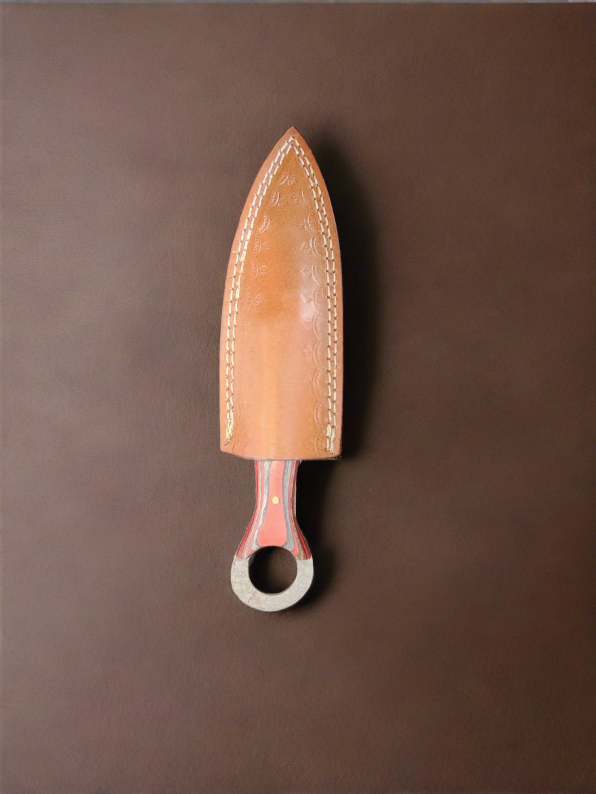 Man Up Damascus Dagger with red and gray wood handle.