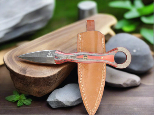 Man Up Damascus Dagger with red and gray wood handle.