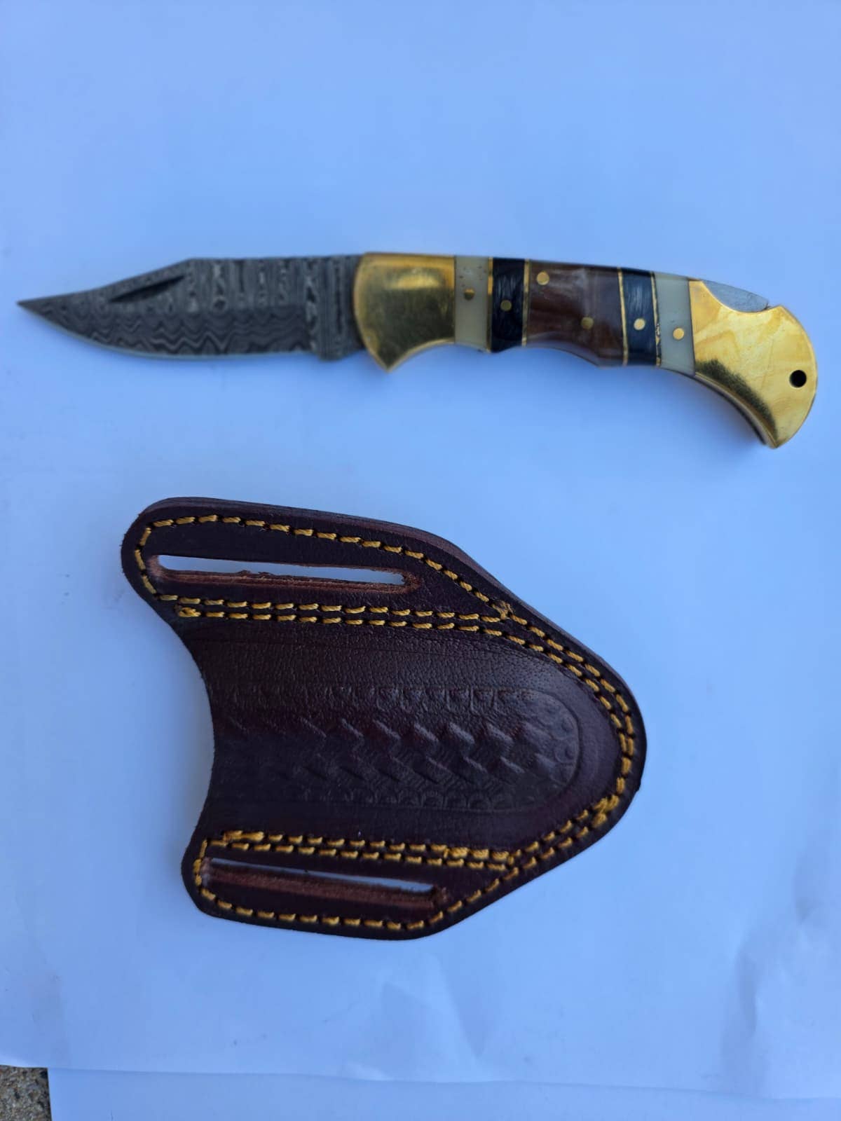 Titan International Titan International - Brass & Bone Damascus Folding Knife with Leather Sheath