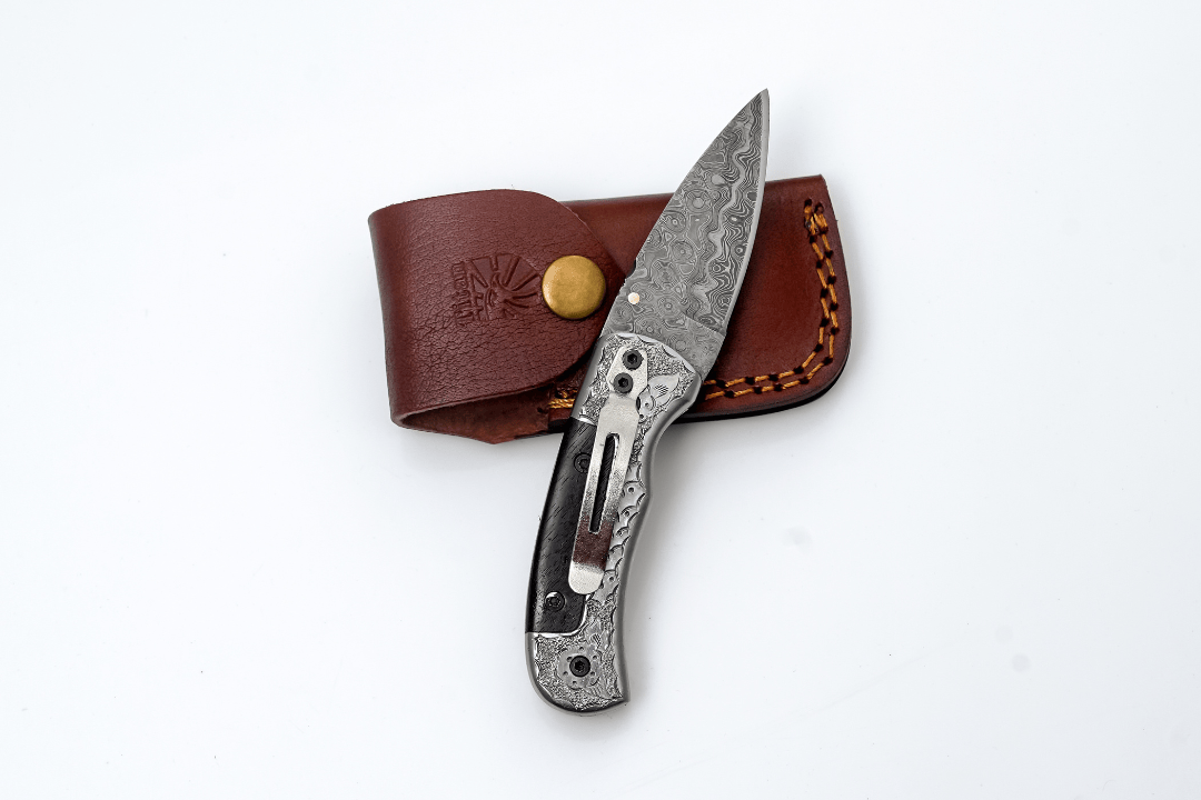 Titan International Titan International - Hand-Forged Damascus Folding Knife | Engraved Bolster, Dark Wood Handle & Intricate Spine File Work
