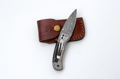 Titan International Titan International - Hand-Forged Damascus Folding Knife | Engraved Bolster, Dark Wood Handle & Intricate Spine File Work