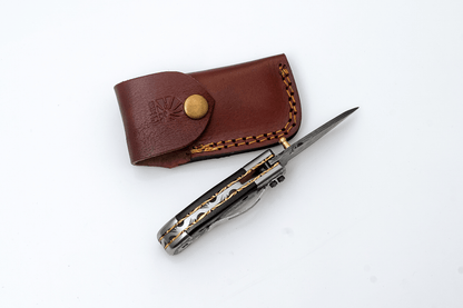 Titan International Titan International - Hand-Forged Damascus Folding Knife | Engraved Bolster, Dark Wood Handle & Intricate Spine File Work