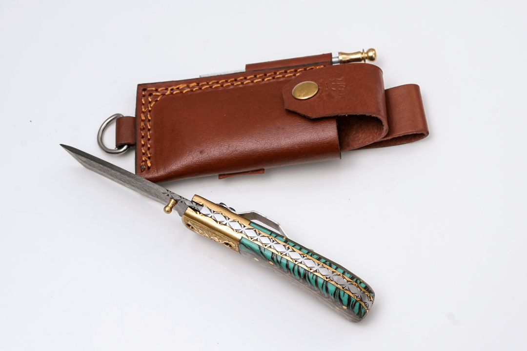 Titan International Titan International - Hand-Forged Damascus Tanto Folder | Teal Pine Cone Handle with Engraved Brass Bolster & Fire Starter