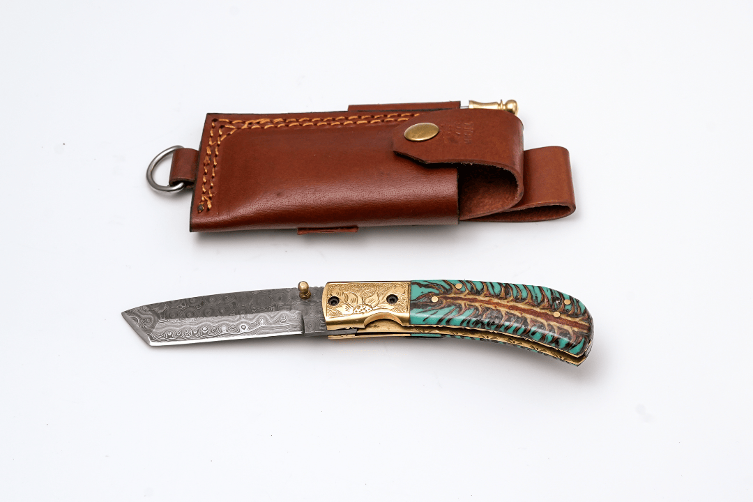 Titan International Titan International - Hand-Forged Damascus Tanto Folder | Teal Pine Cone Handle with Engraved Brass Bolster & Fire Starter