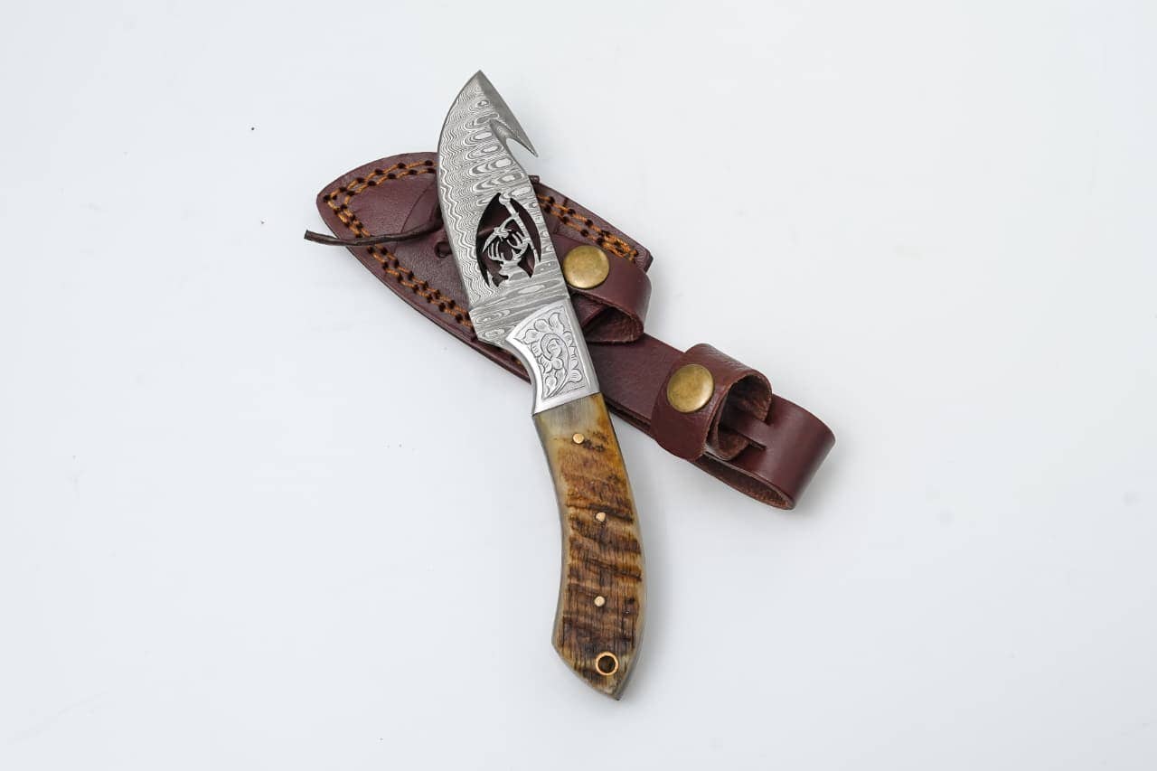 Titan International Titan International - Wire-Cut Damascus Guthook Knife with Ram Horn Handle
